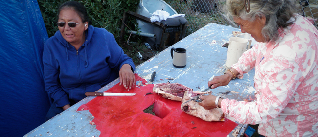 Ladies preparing diner in Wollaston Lake<br>Photo courtesy of CanNorth